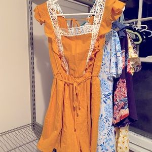 BRAND NEW Mustard Romper with Crochet & Ruffle Detailing!!